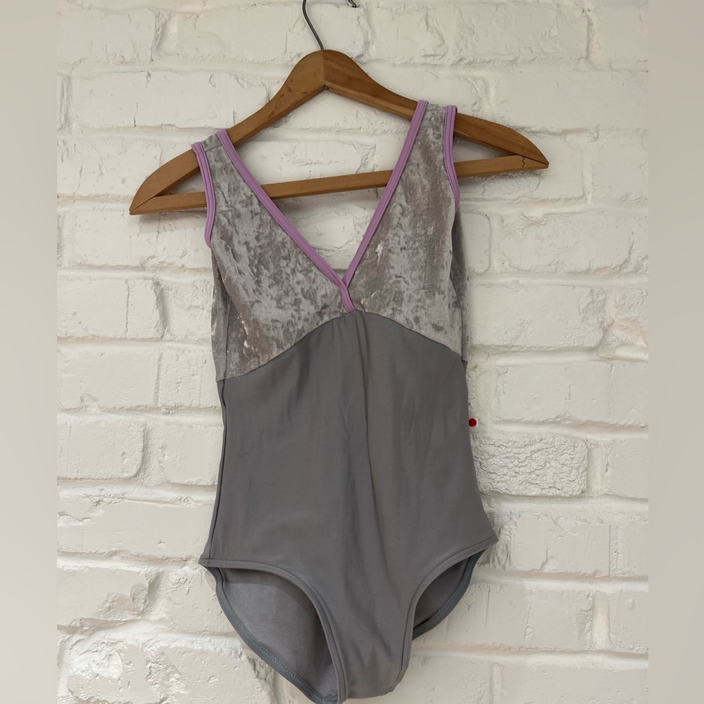 Yumiko gray leotard with lilac trim.